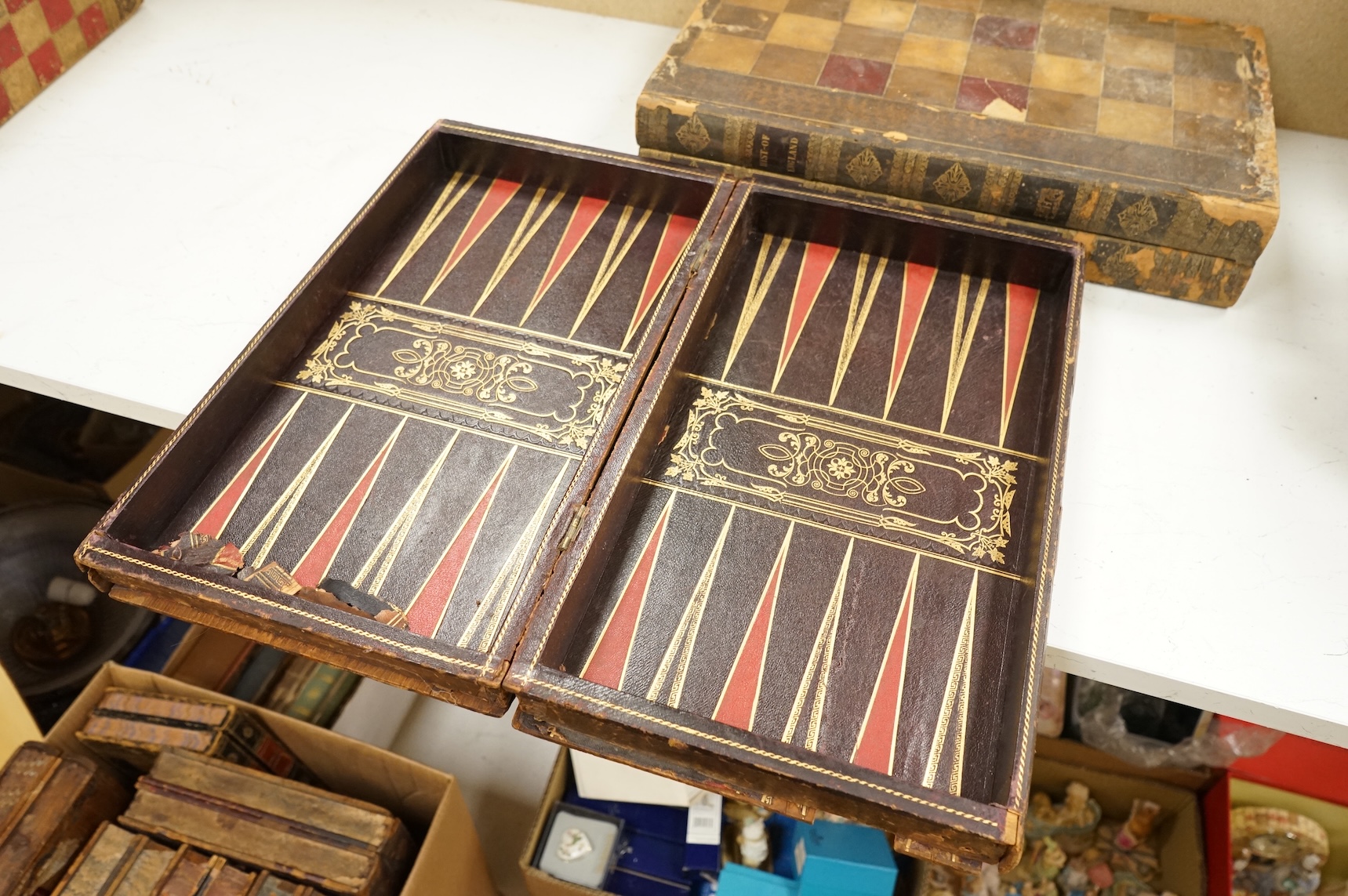 Three folding chess and backgammon boards in the form of books, 42cm